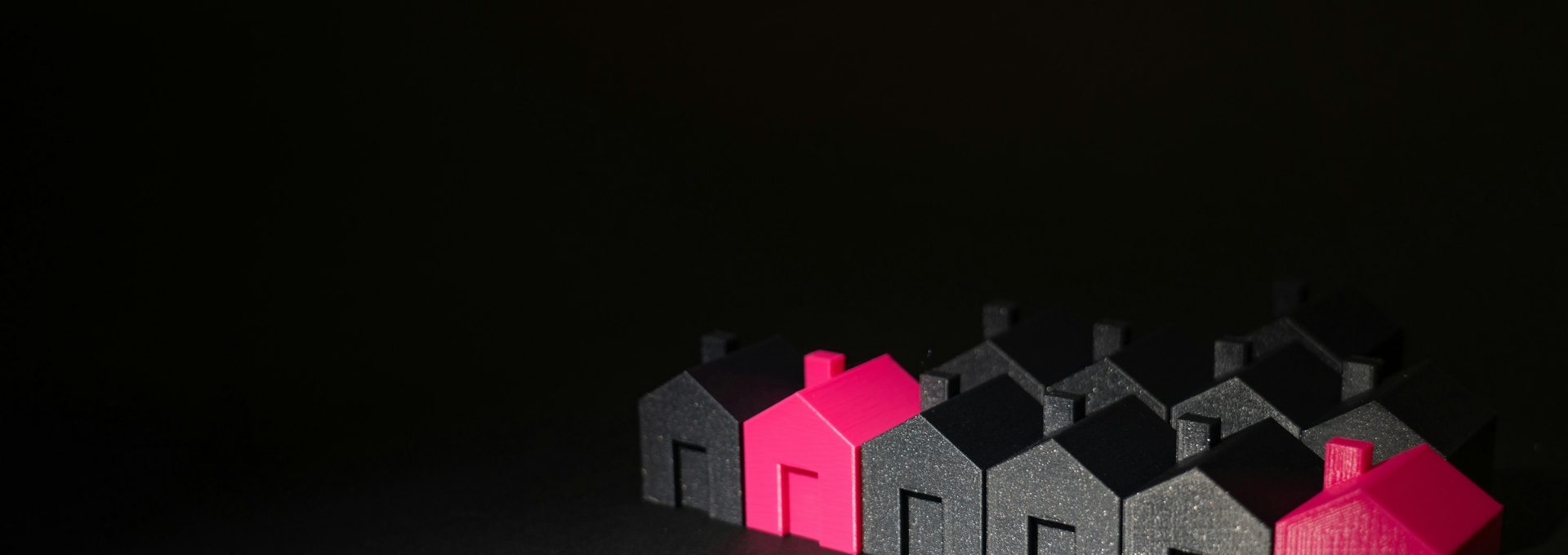 A row of small houses sitting on top of a table