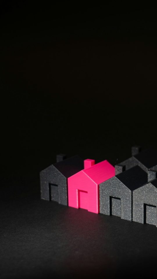 A row of small houses sitting on top of a table